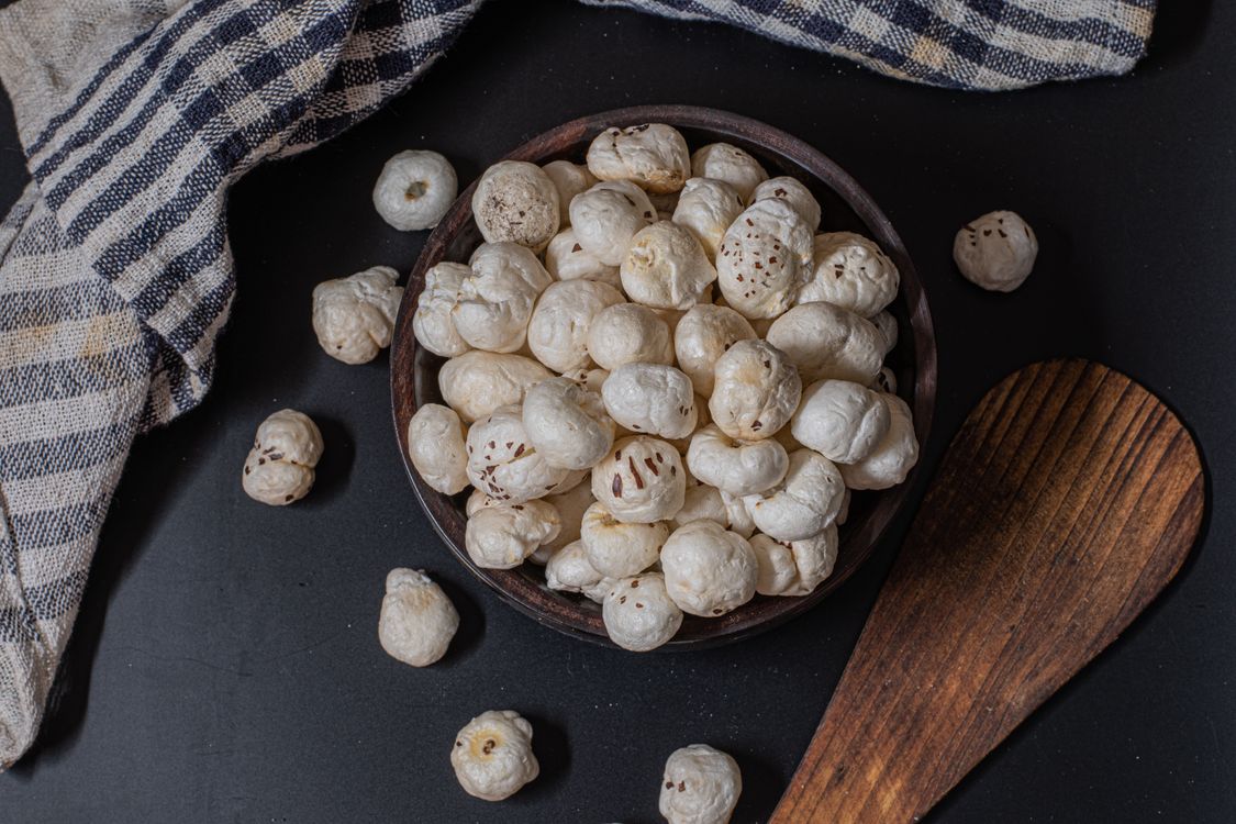 Makhana Powder - puffed lotus seeds makhana in rustic bowl