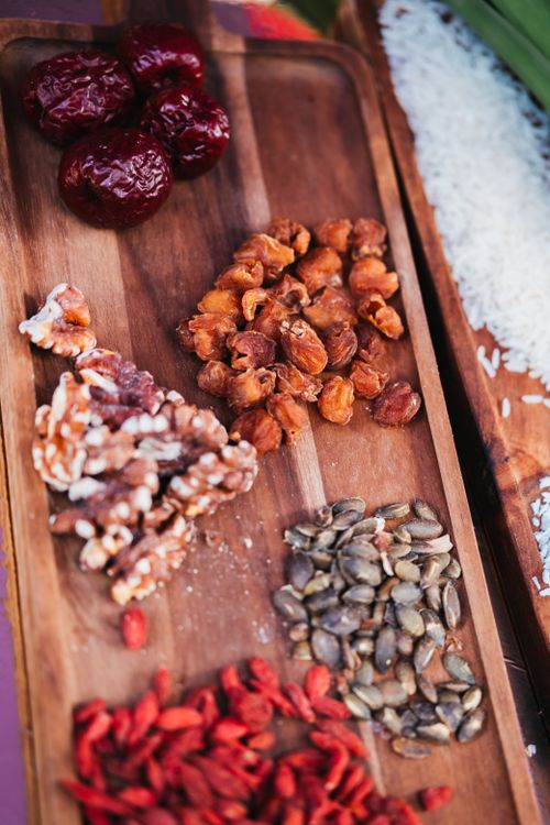 Superfoods and Wellness - assorted healthy superfoods on wooden tray